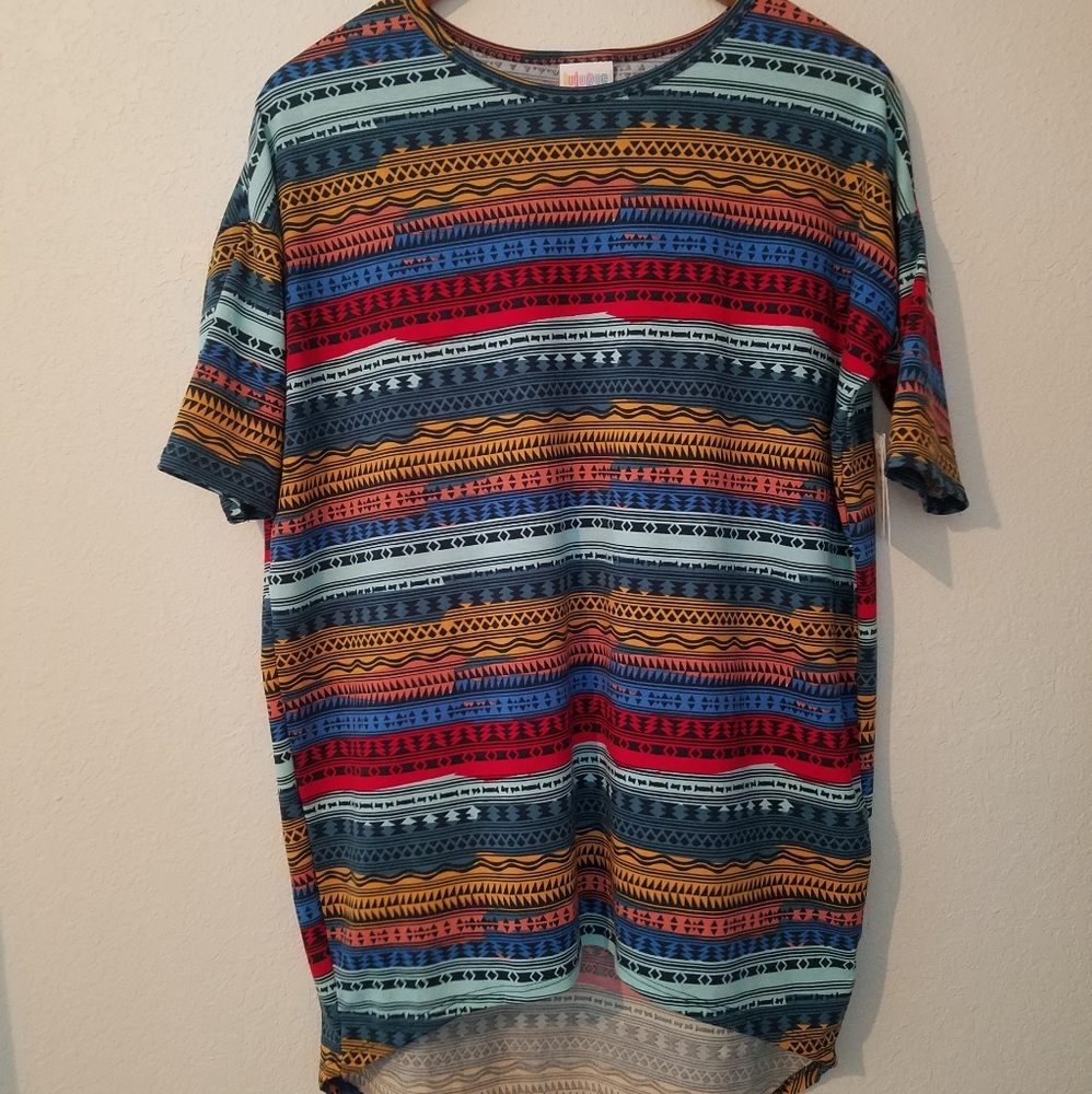 Tunic top. Runs big. I usually wear a S/M top